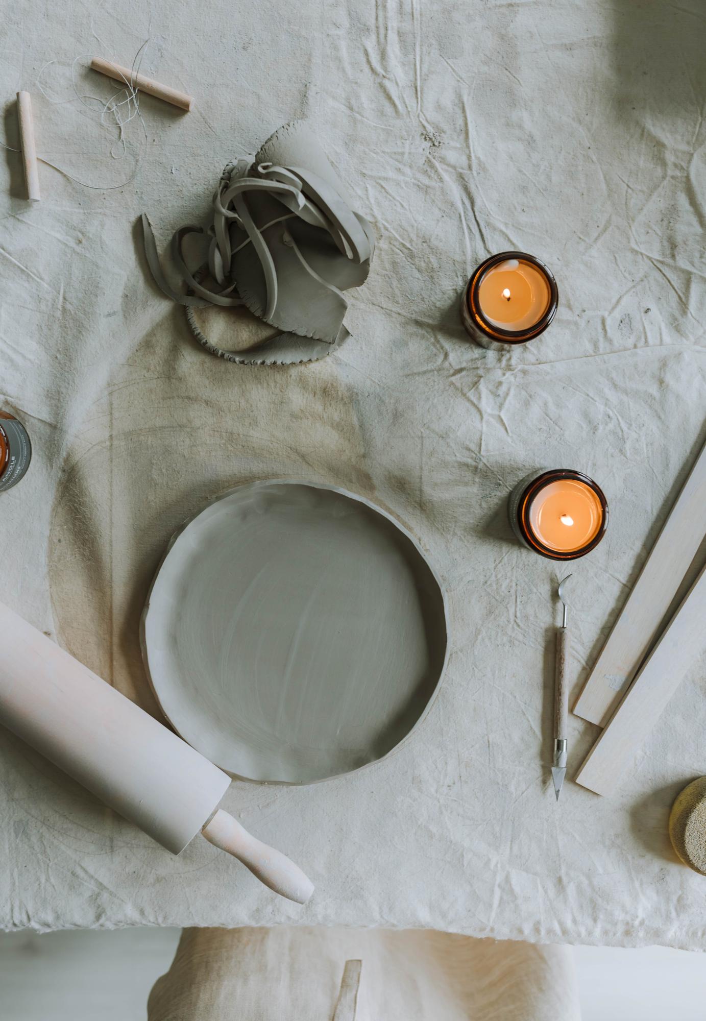 Rustic table setting with candles and ceramics