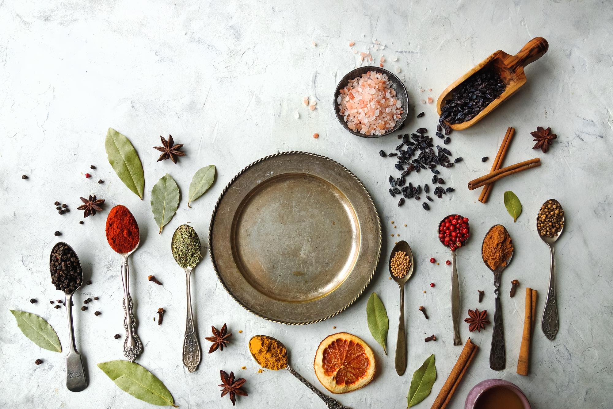 Close detail of spices and herbs in bowls