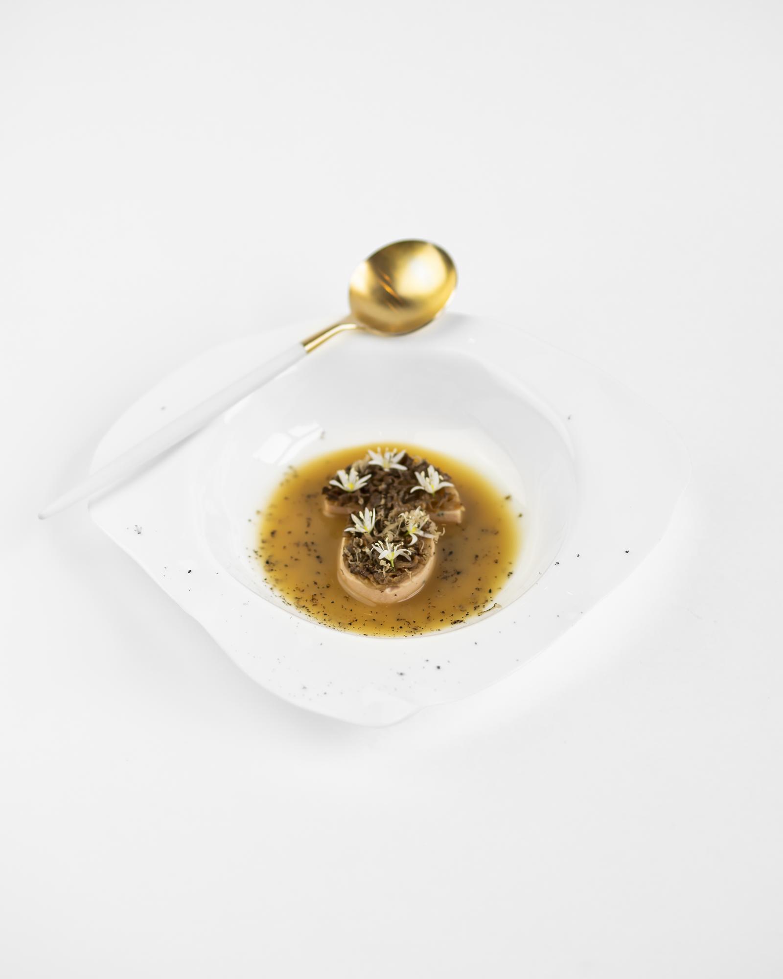 Close-up of plated gourmet dish with layered textures